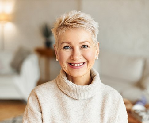Beautiful older woman, enjoying the benefits of All-on-4 tooth replacement