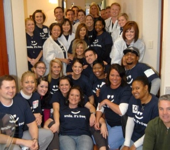 The Huckabee Dental team wearing matching shirts