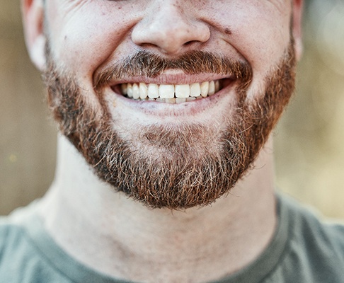 a close-up of a man’s smile