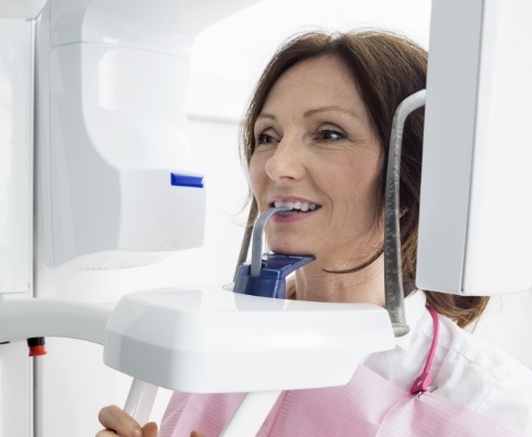 Woman receiving 3 D cone beam digital x-ray scans